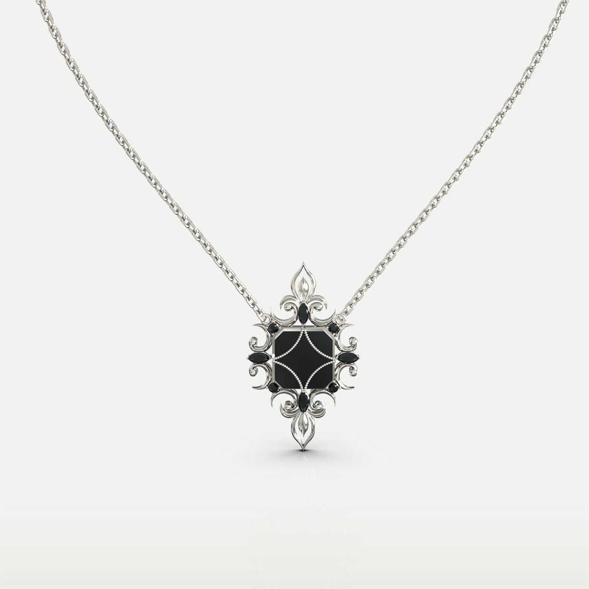 Black Onyx Pendant Necklace in 925 sterling silver, front view of the black onyx center within an ornate floral silver setting on a chain