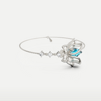 Blue Topaz Lotus Bracelet in 925 sterling silver, angled view of the lotus motif and slim bangle-style band