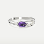 Violet Dew Ring, pear-cut amethyst in a split-shank sterling silver band, three-quarter front view