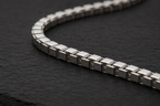 Close-up of polished 925 sterling silver box chain necklace links
