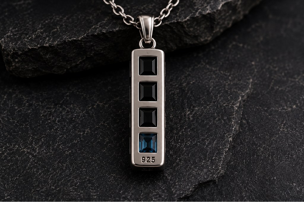 Front view of Praise Jewels Monolith Bar Pendant with black onyx and blue topaz
