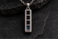 Front view of Praise Jewels Monolith Bar Pendant with black onyx and blue topaz