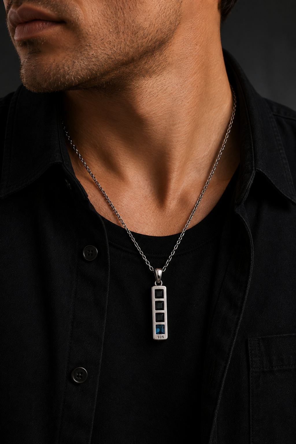 Praise Jewels Monolith Bar Pendant with black onyx and blue topaz worn by a man