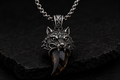 Close-up detail of Praise Jewels Wolf Tooth Pendant and smoky quartz gemstone