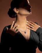 Black Onyx Pendant Necklace in 925 sterling silver, close-up detail resting at the collarbone