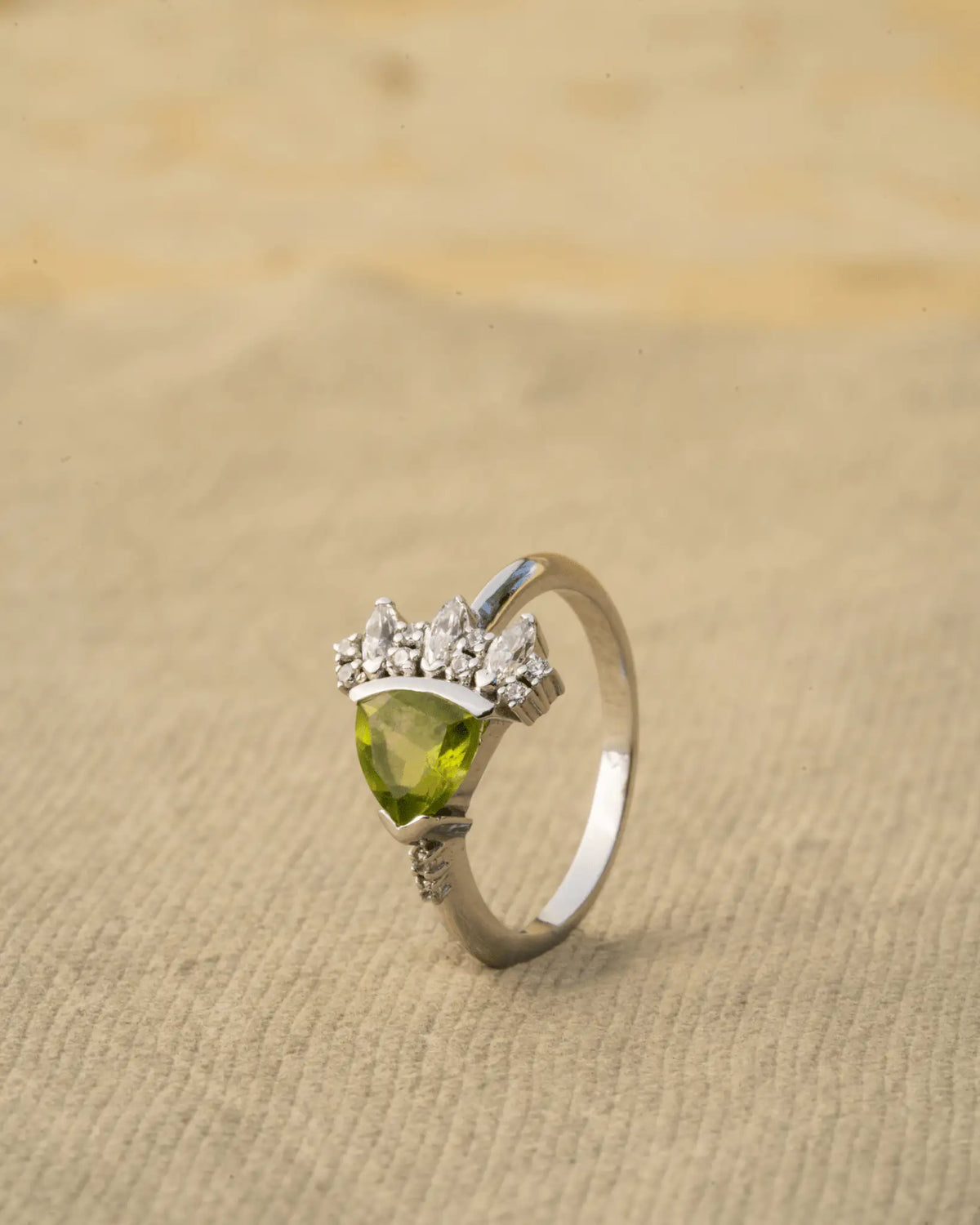 Peridot Bloom Ring in 925 sterling silver, front view worn on the finger