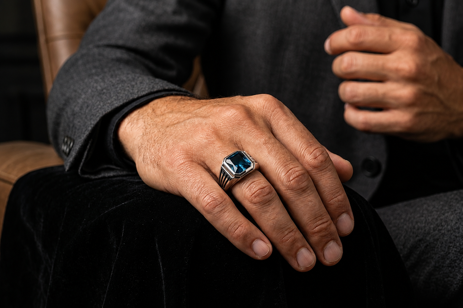 Royal Crest Ring with natural London Blue Topaz worn by a man